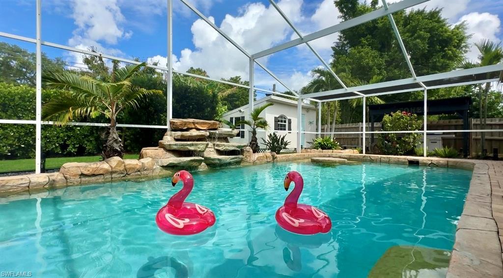 View of pool featuring a lanai