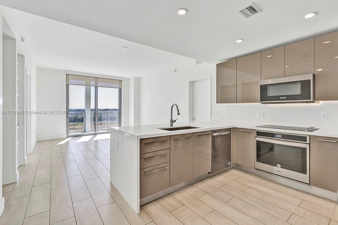 a large kitchen with cabinets