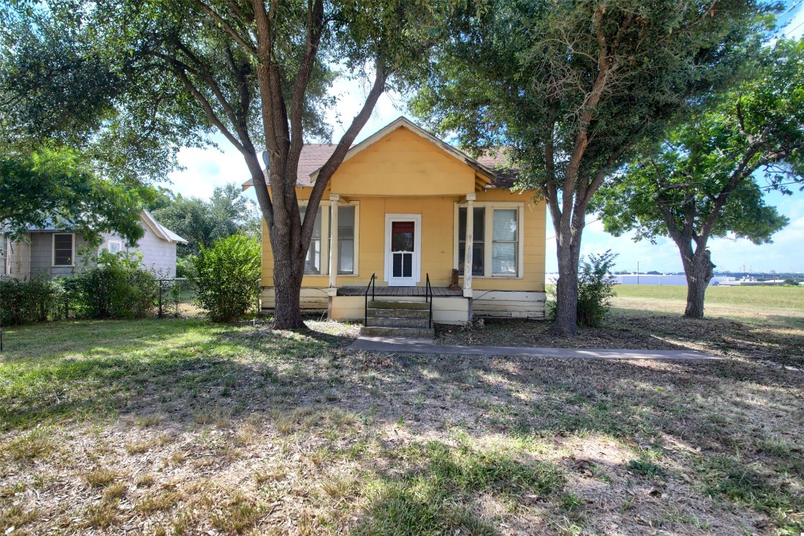 a house with trees in the background