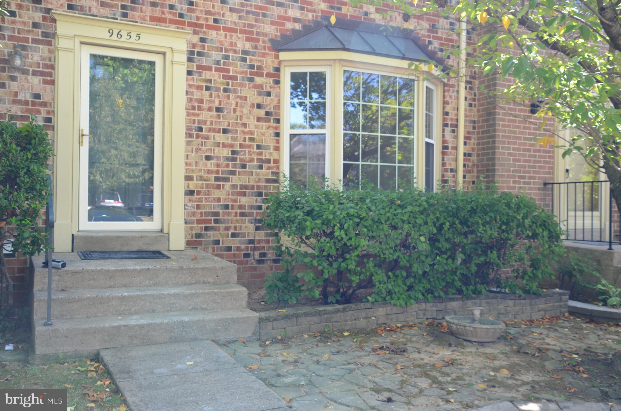 a view of house with yard