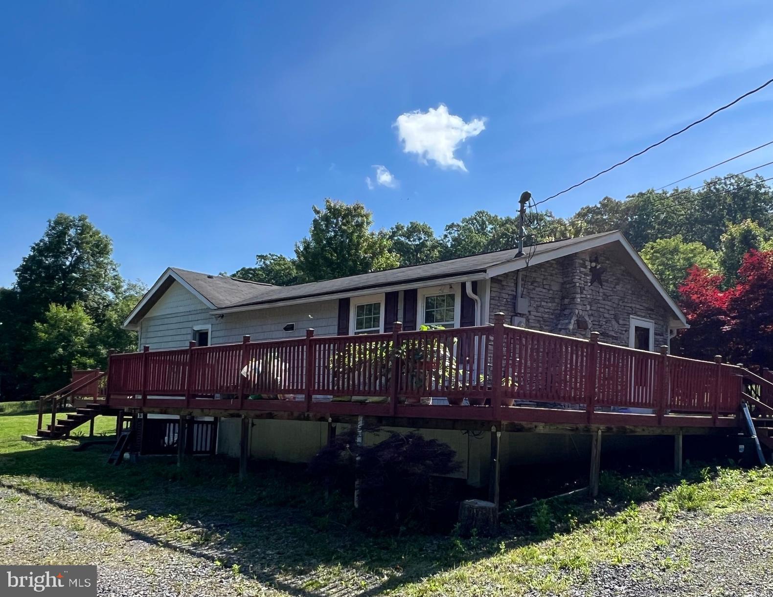 a view of house with a yard