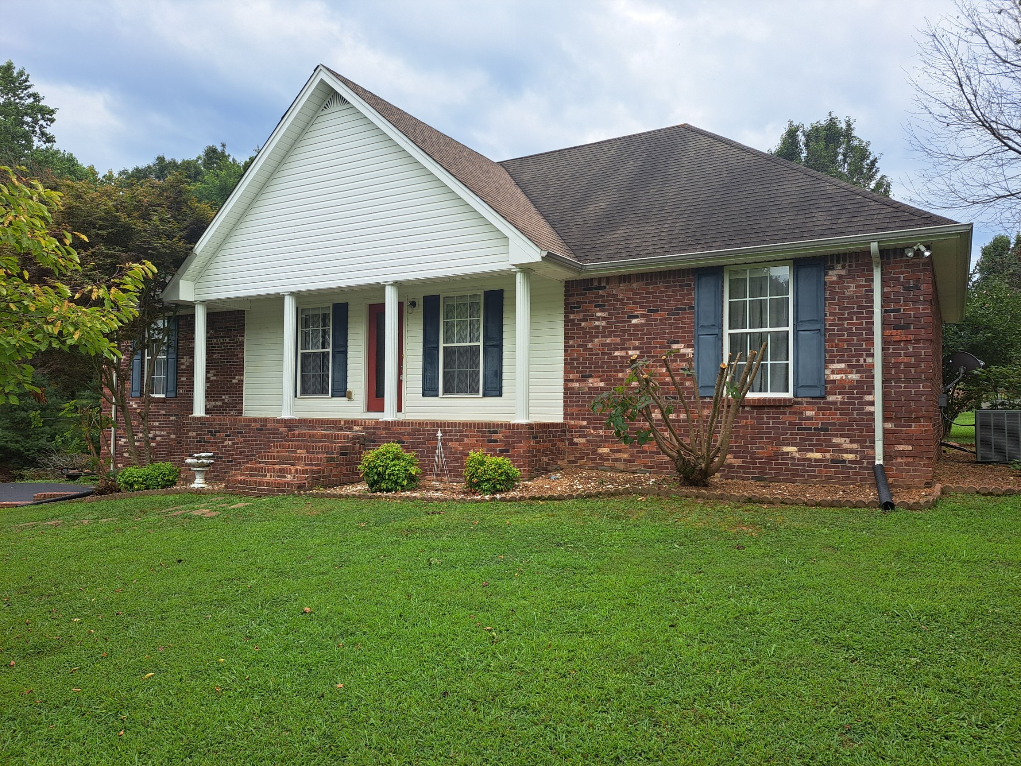 front view of a house with a yard