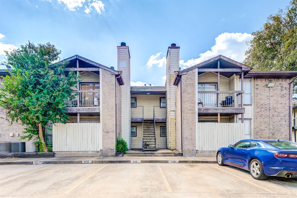 a front view of a house with parking space