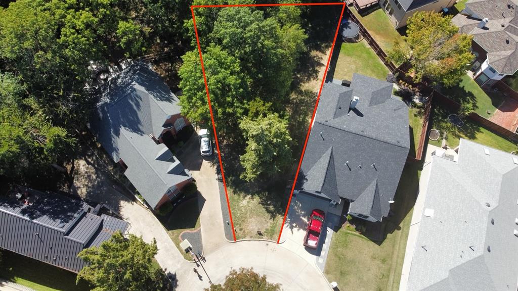 an aerial view of houses with yard