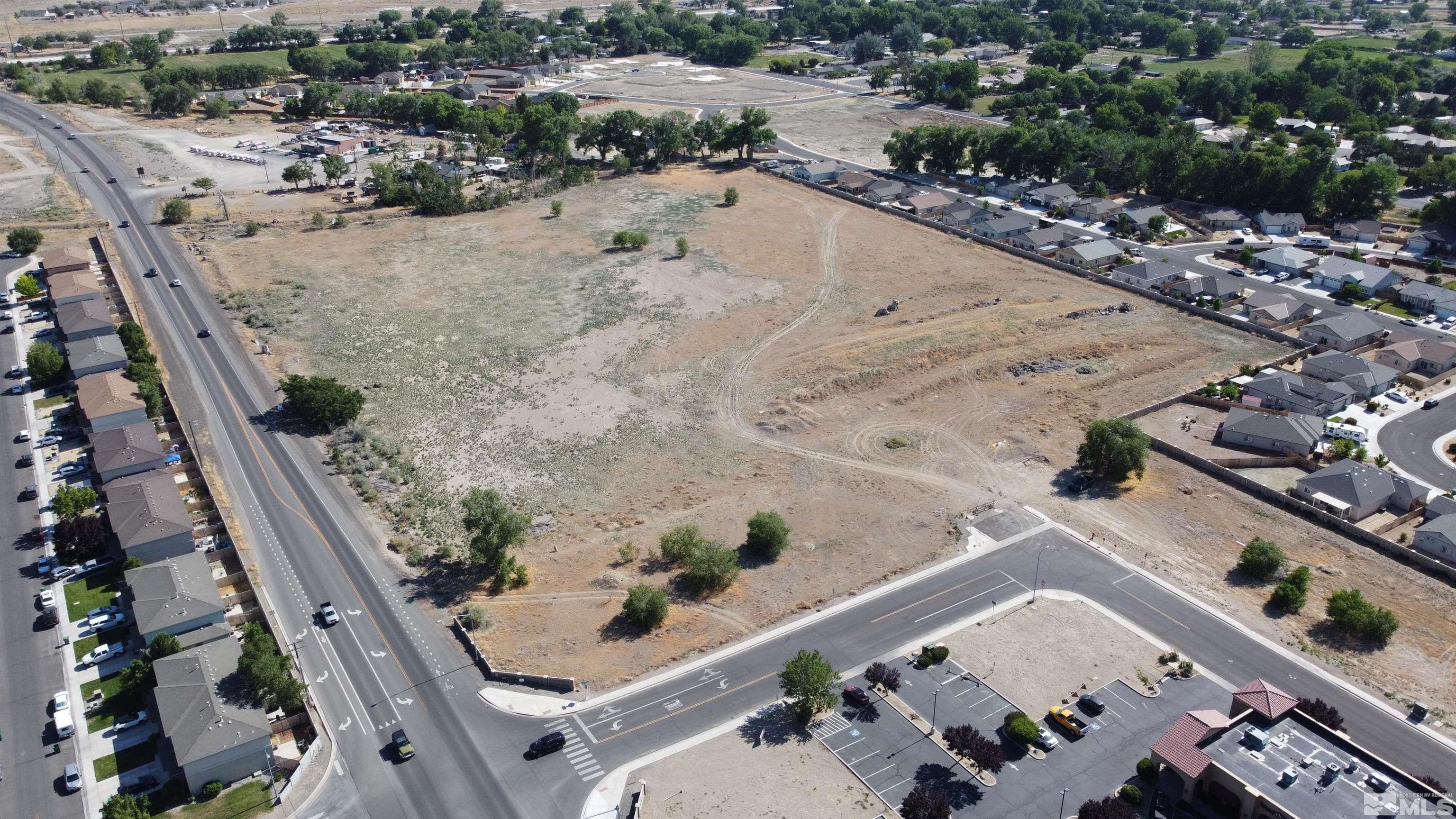 an aerial view of house with a yard