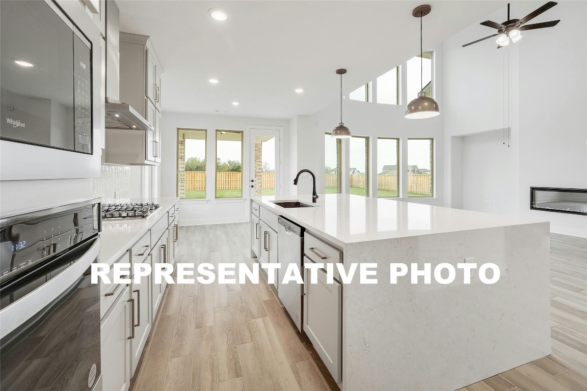 a view of a kitchen and an entryway