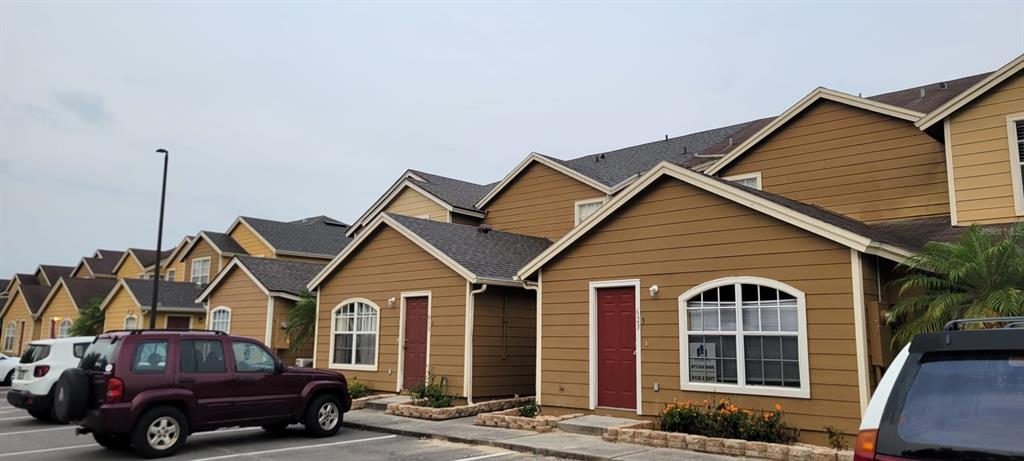 a front view of a house with parking space