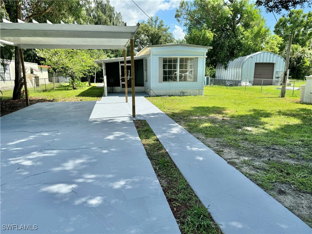 a front view of house with yard patio and green space