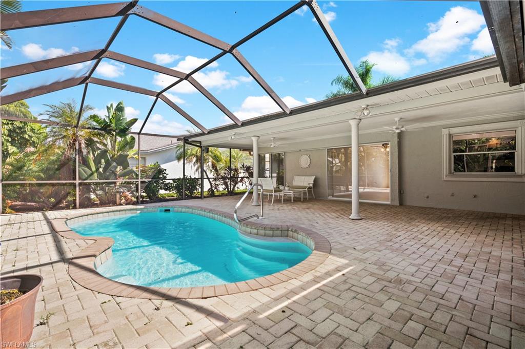 a view of a swimming pool with a patio