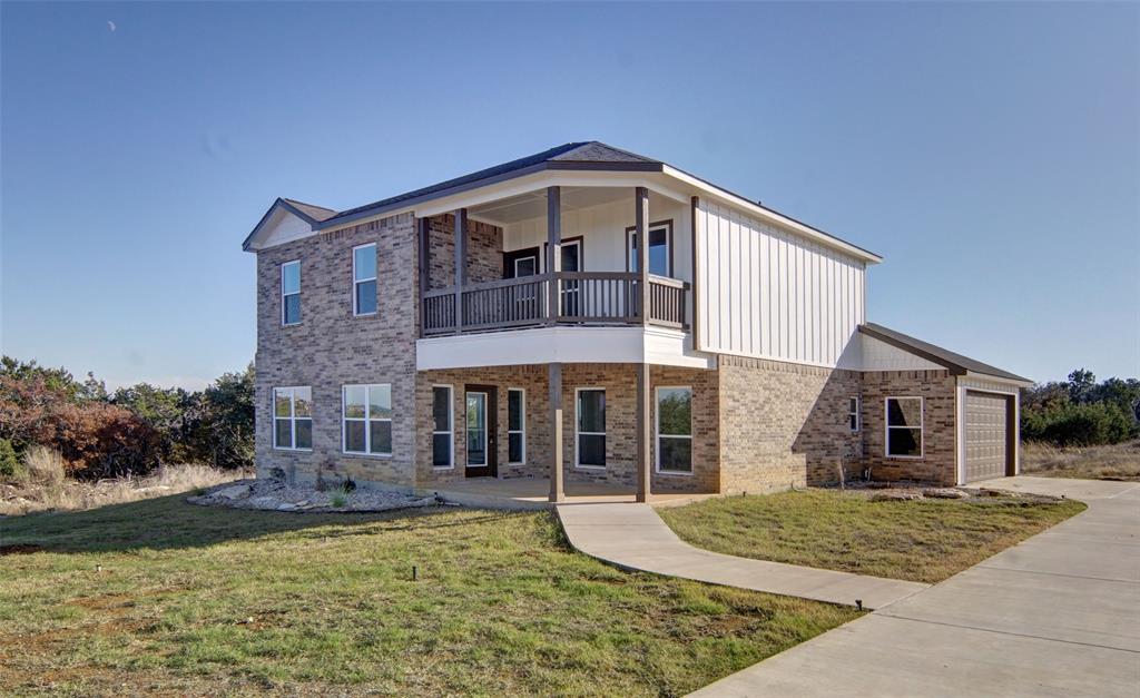 a view of a house with backyard porch and sitting area