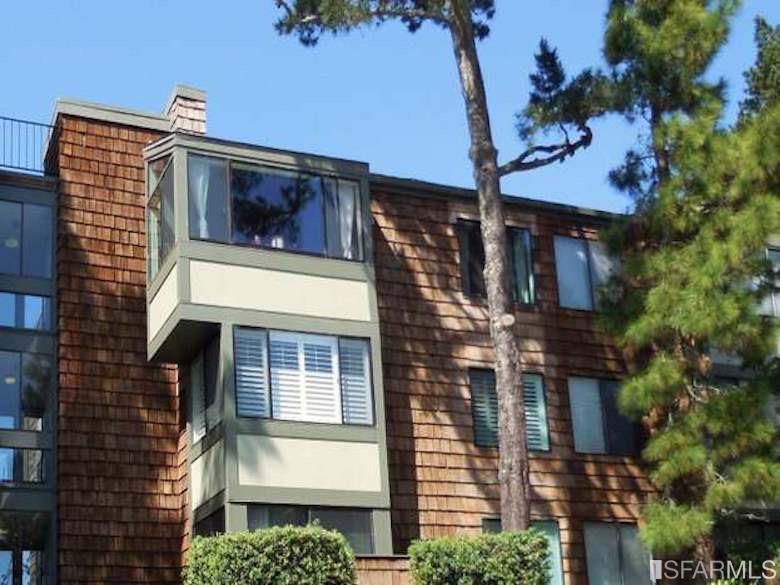 a view of a building with a tree