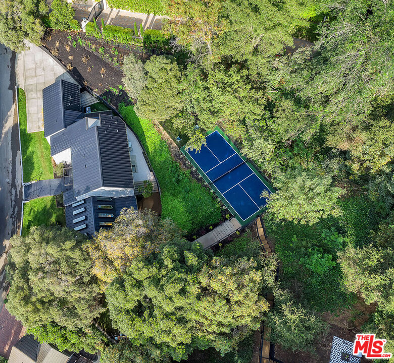 a aerial view of a house with a yard