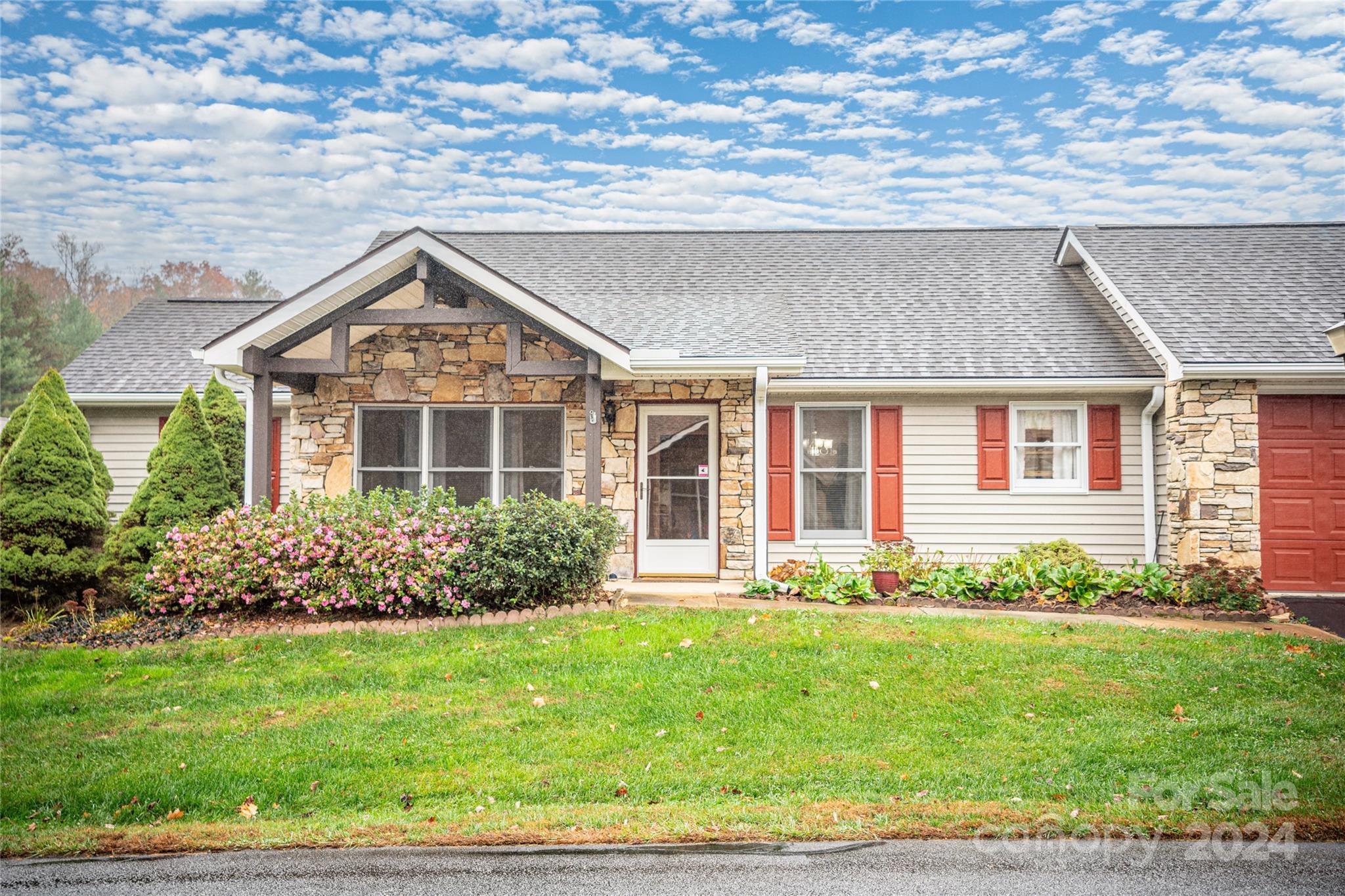 a front view of a house with garden