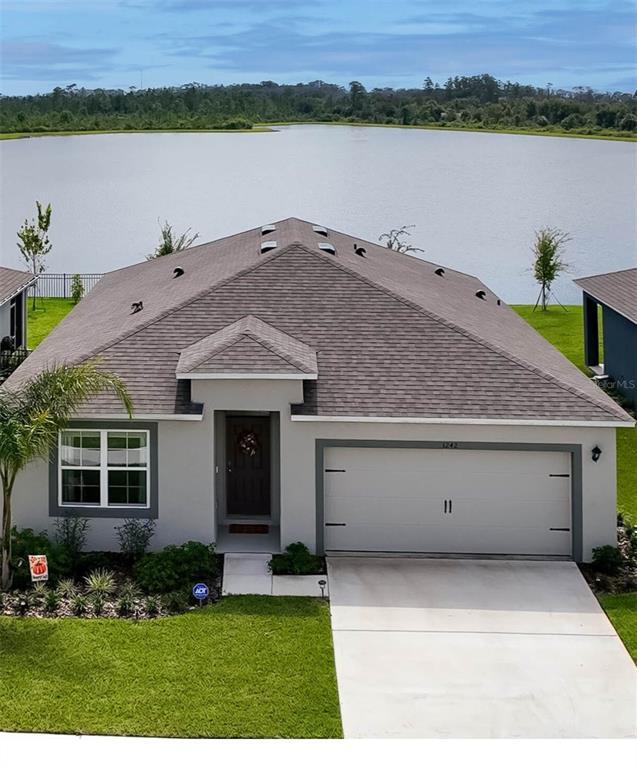 a house view with a lake view