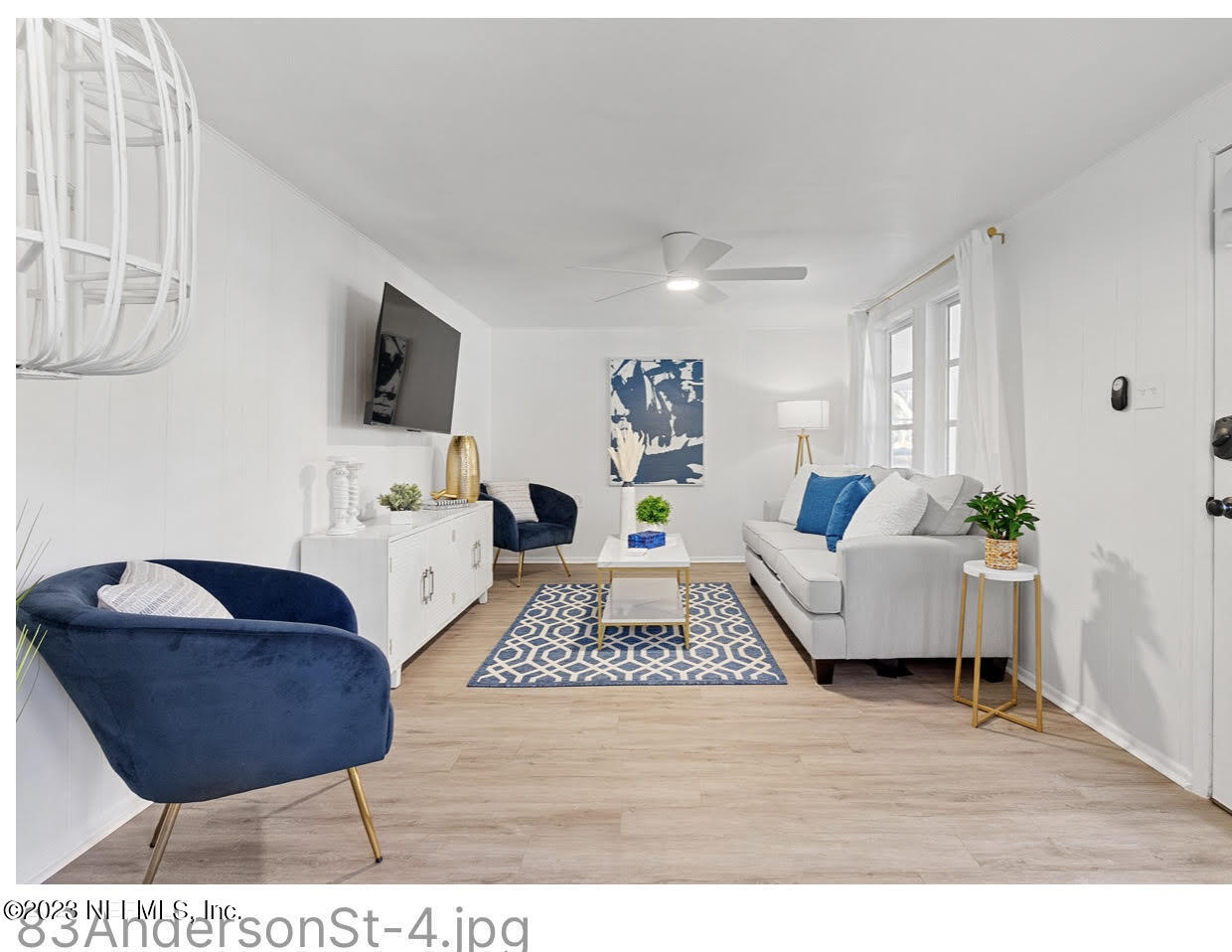 a living room with furniture and a flat screen tv