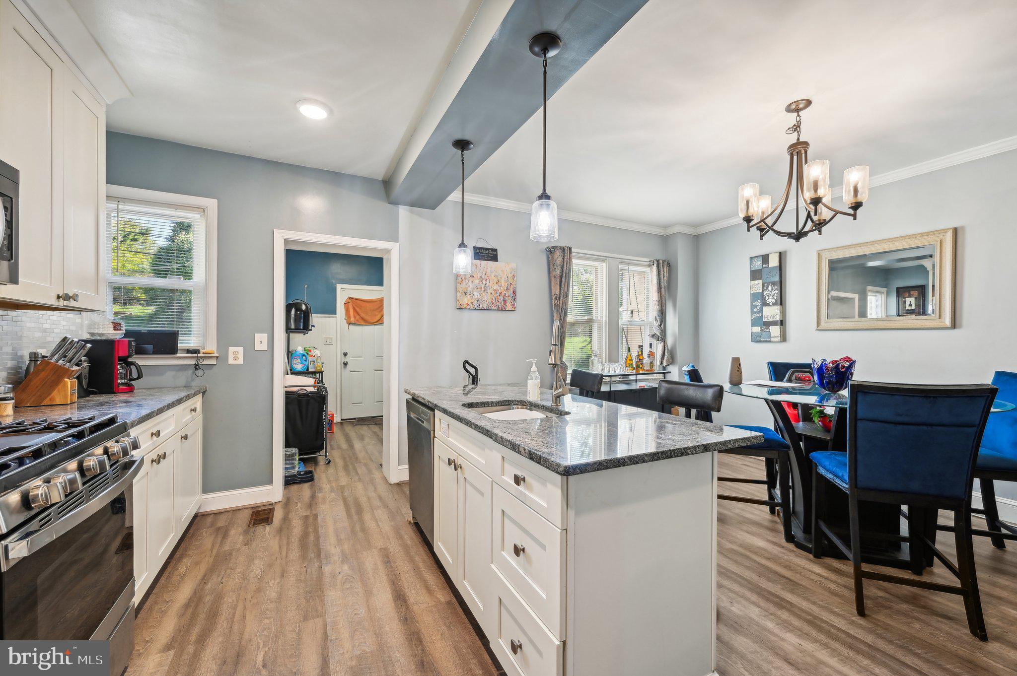 a kitchen that has a lot of counter space and appliances