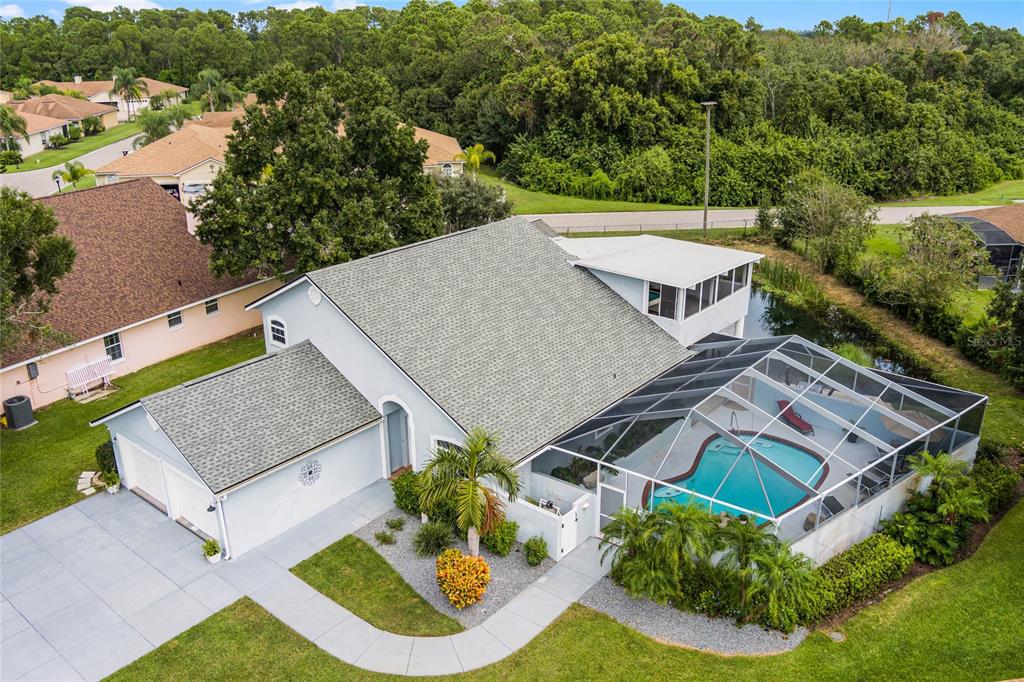 an aerial view of a house with a garden