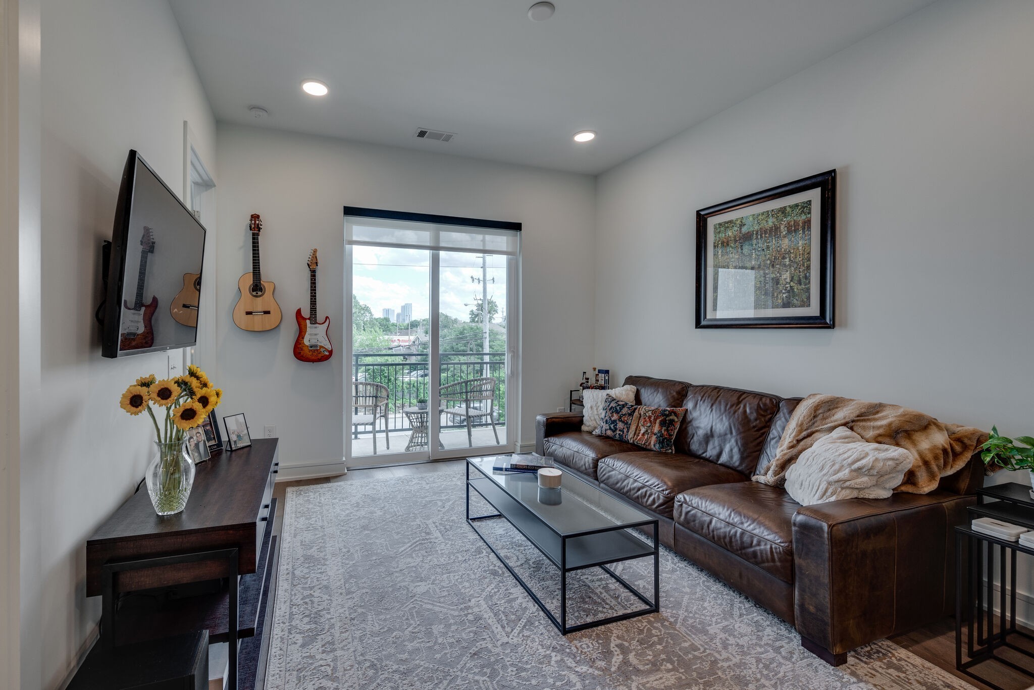 a living room with furniture and a flat screen tv