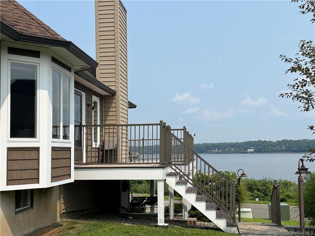 a balcony with wooden floor and fence