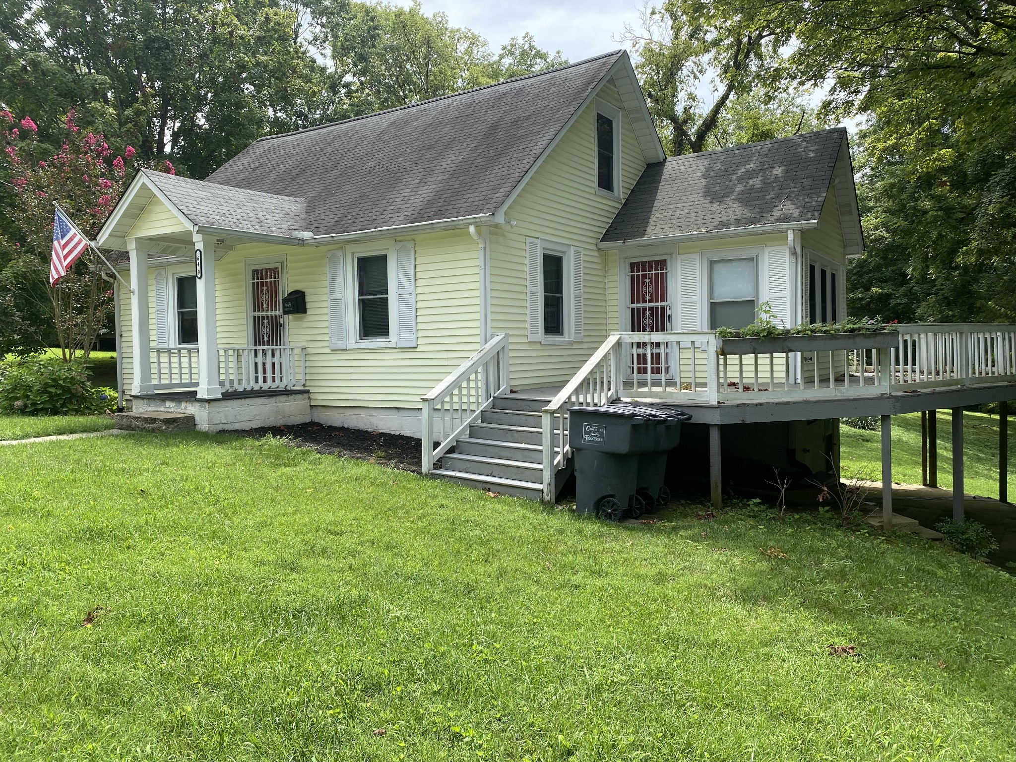 a view of a house with a backyard and a patio