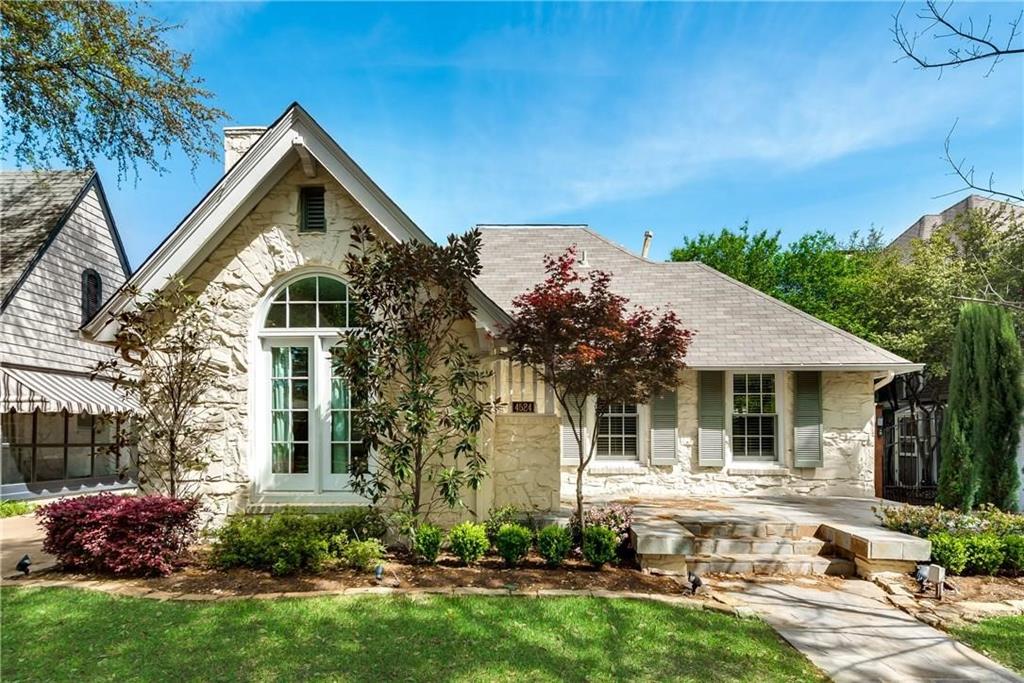 a front view of house with yard and outdoor seating