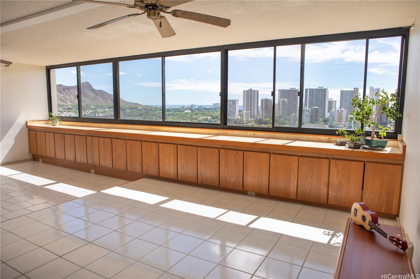 a view of a room with furniture and a large window