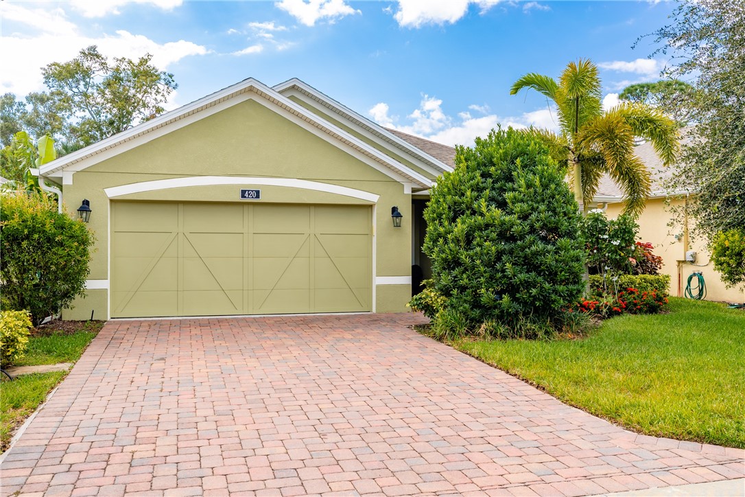 a view of a garage with a yard