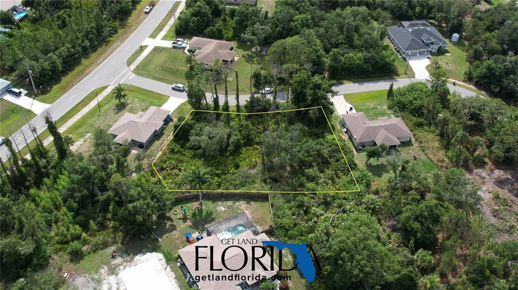 an aerial view of a house with a garden