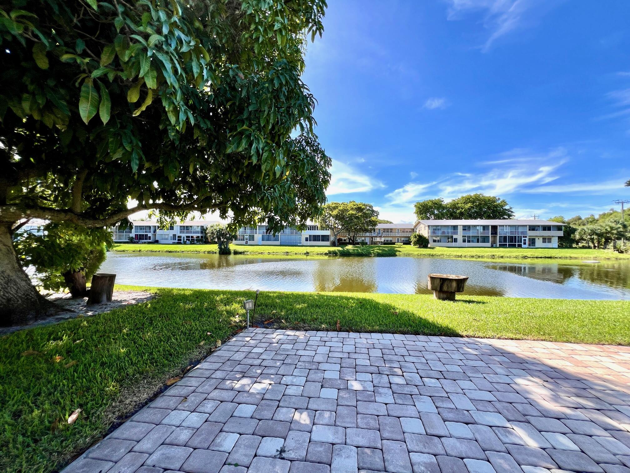 a view of a swimming pool and a yard