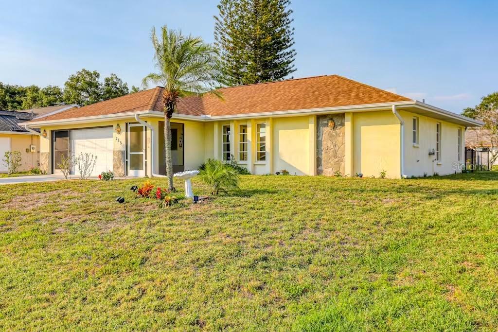 a front view of a house with garden