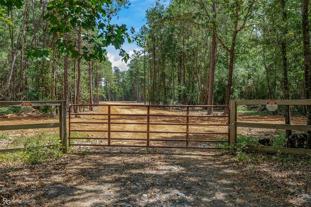 a view of park with wooden fence