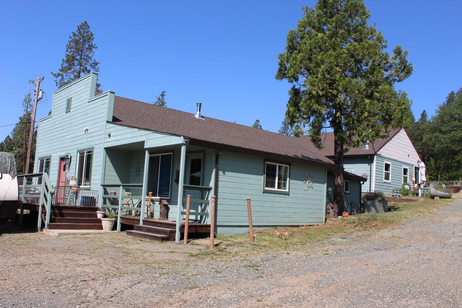 a view of a house with a patio and a garage