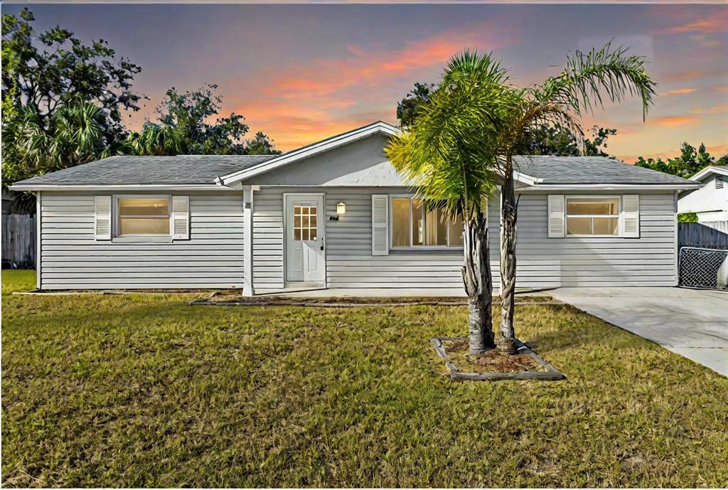 front view of a house with a yard