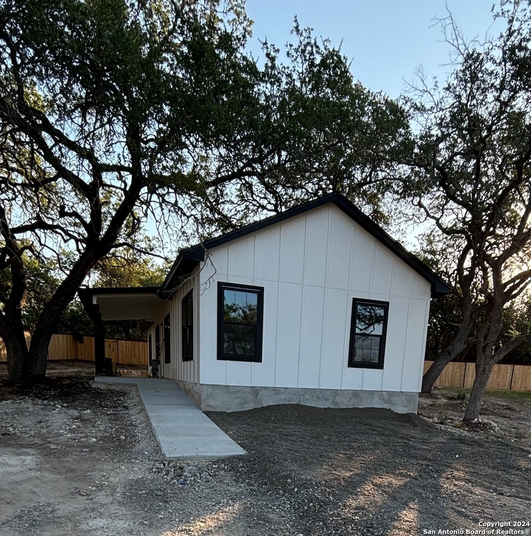 a house with trees in the background