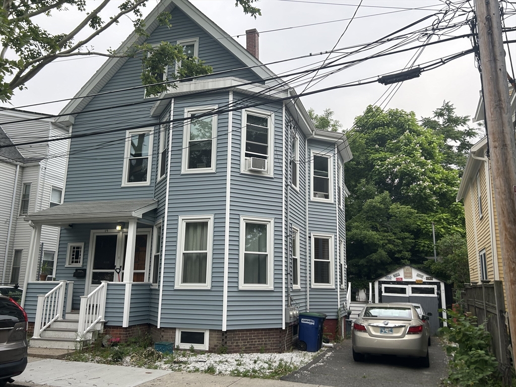 a front view of a house with parking