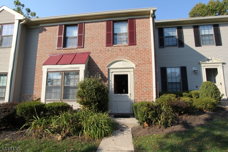 a front view of a house having yard