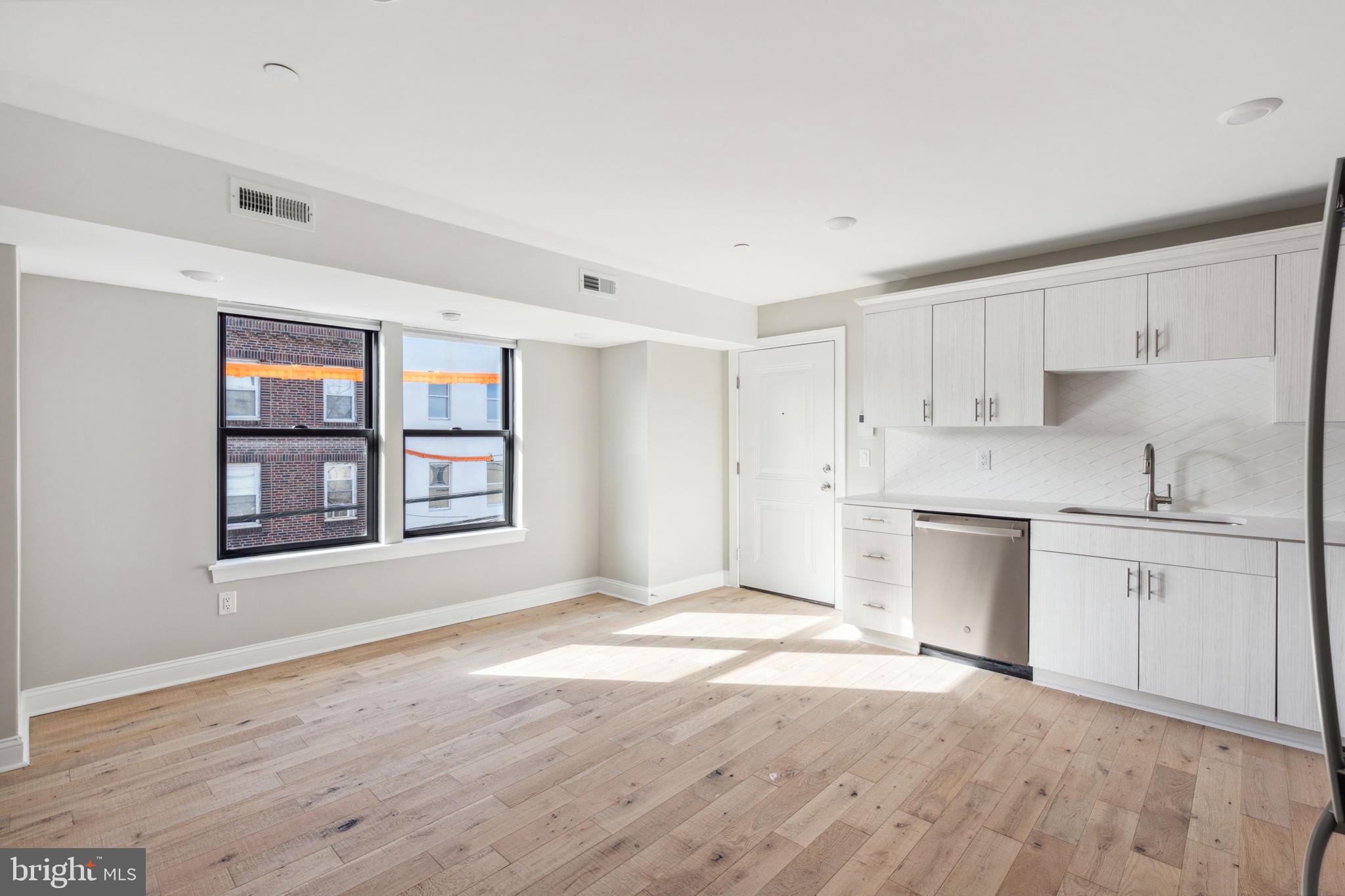 a view of a kitchen with a sink cabinets and a window