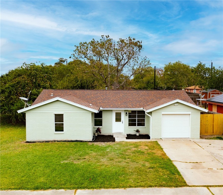 a view of a yard in front of a house with a yard