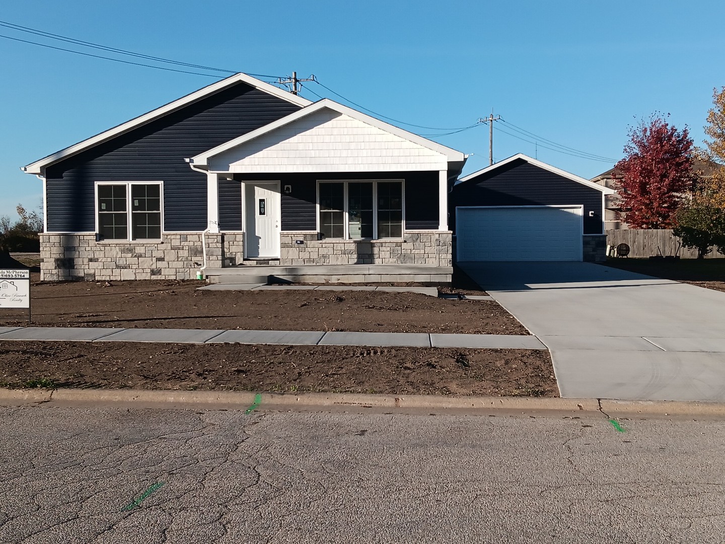 a front view of a house with yard