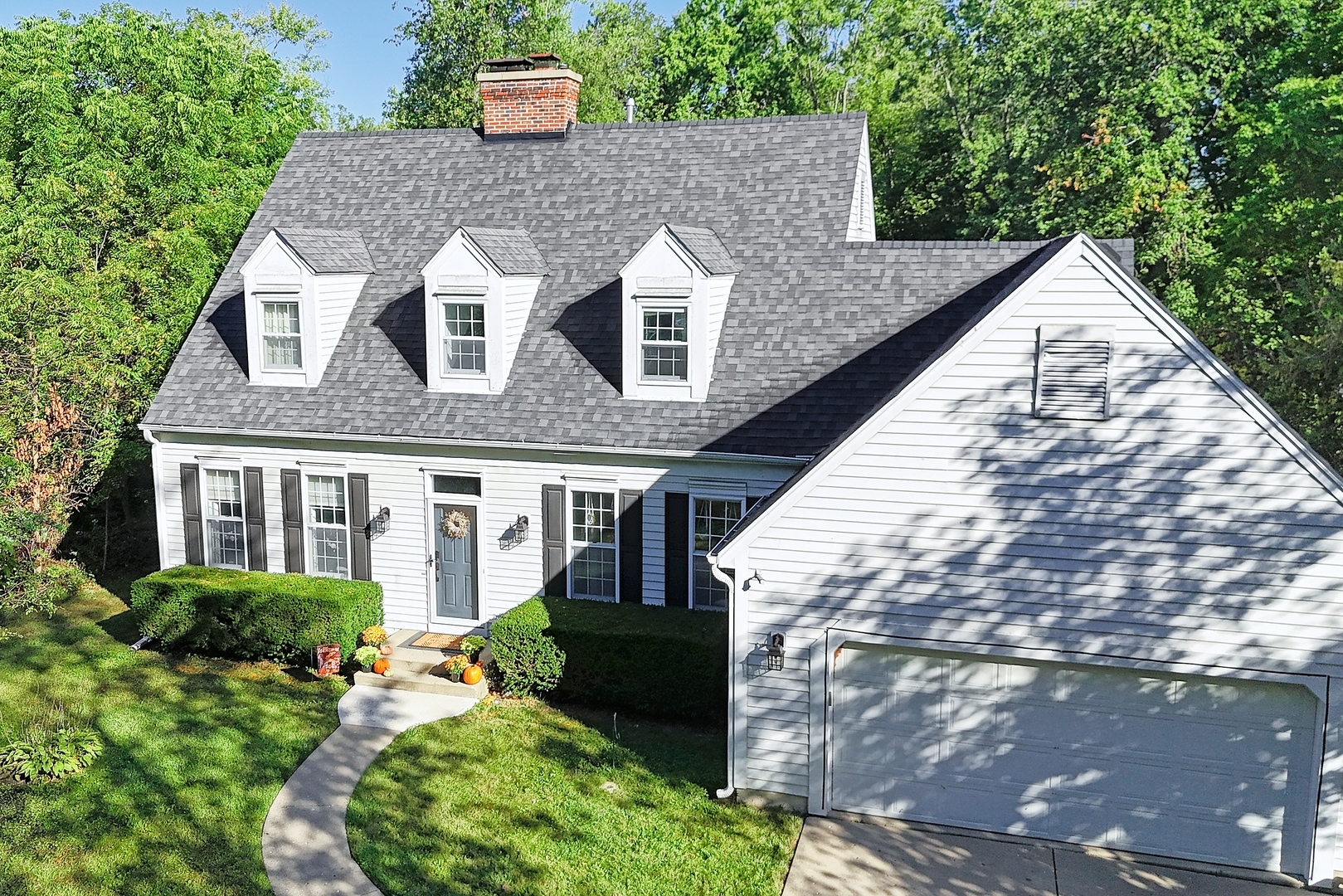 a aerial view of a house with a yard