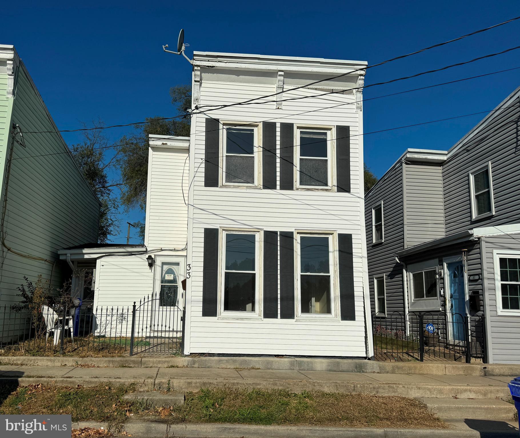 a view of residential houses with street