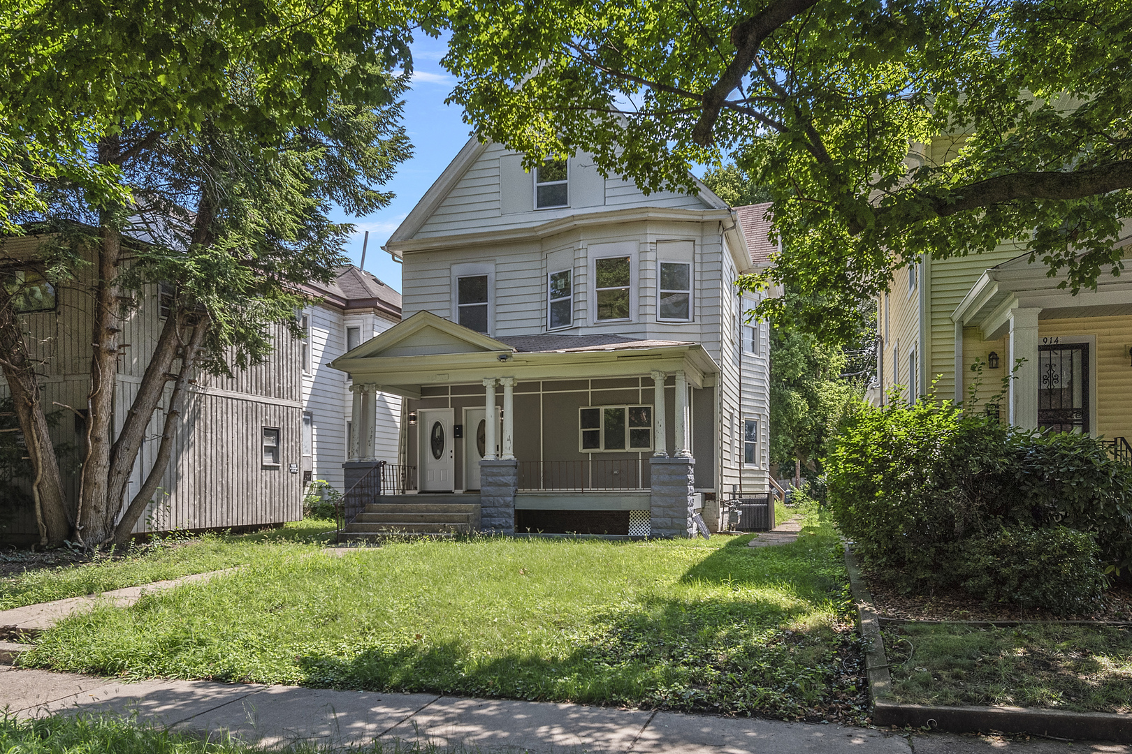 front view of a house with a yard