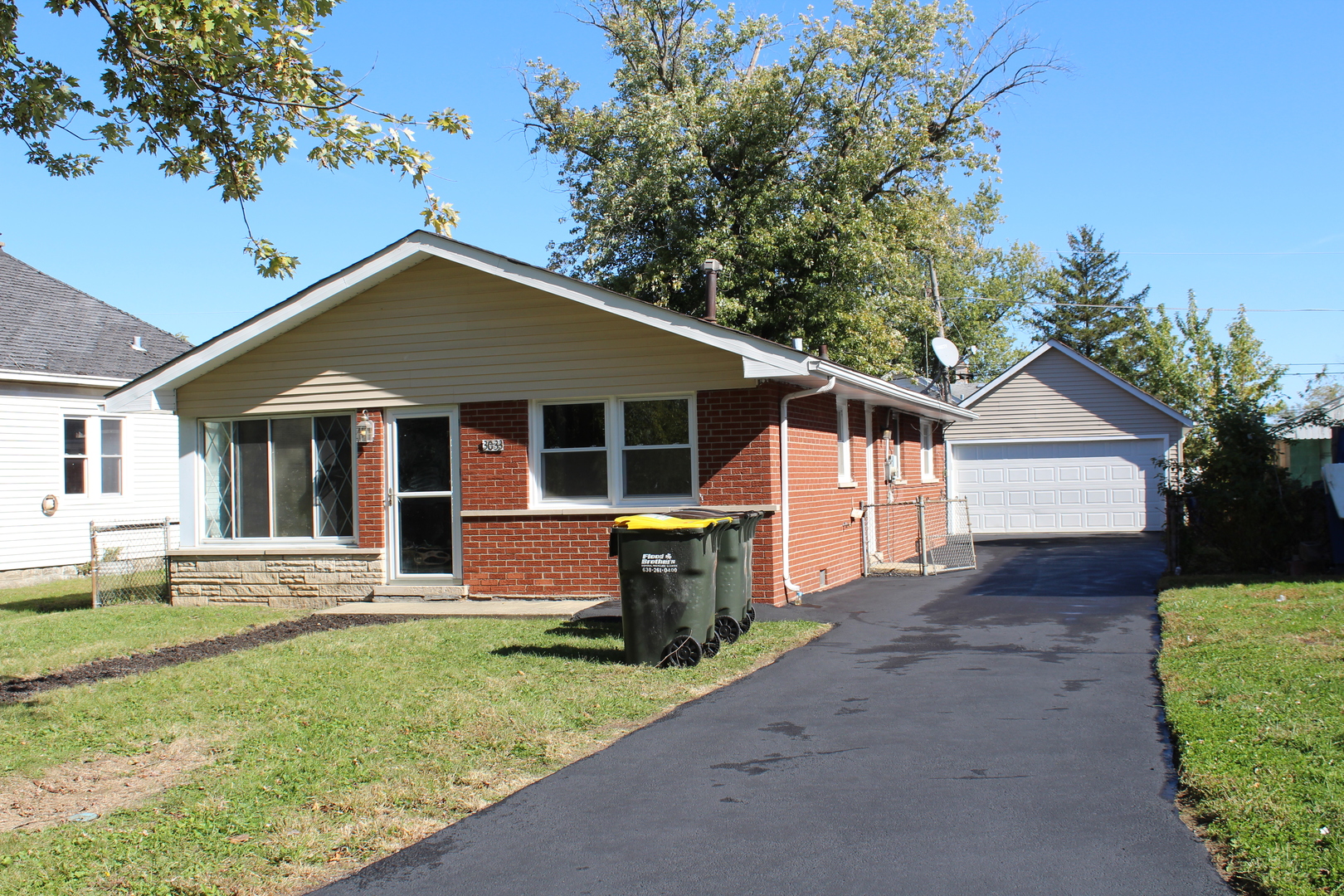 a front view of a house with a yard and porch