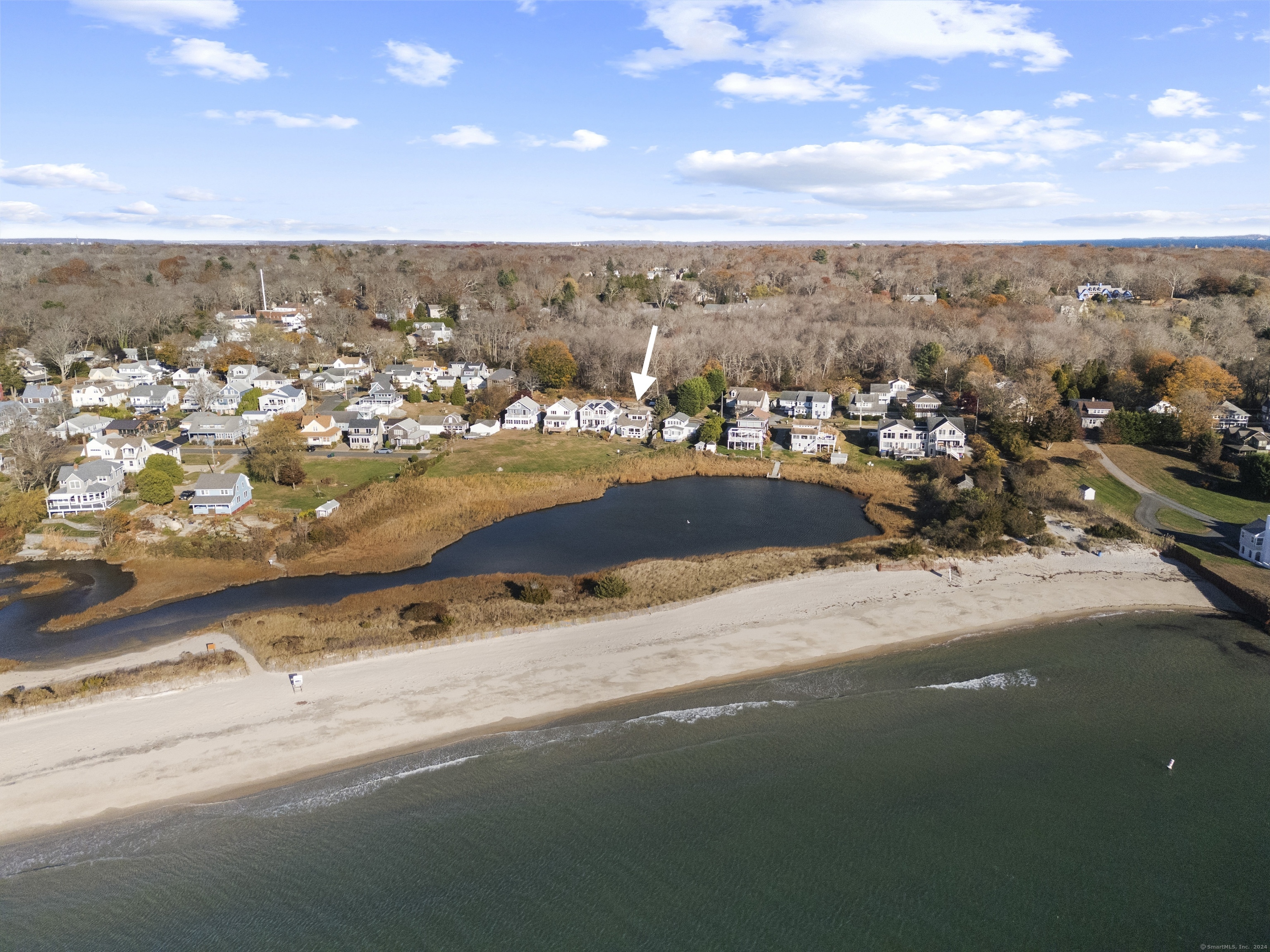 an aerial view of residential building and ocean