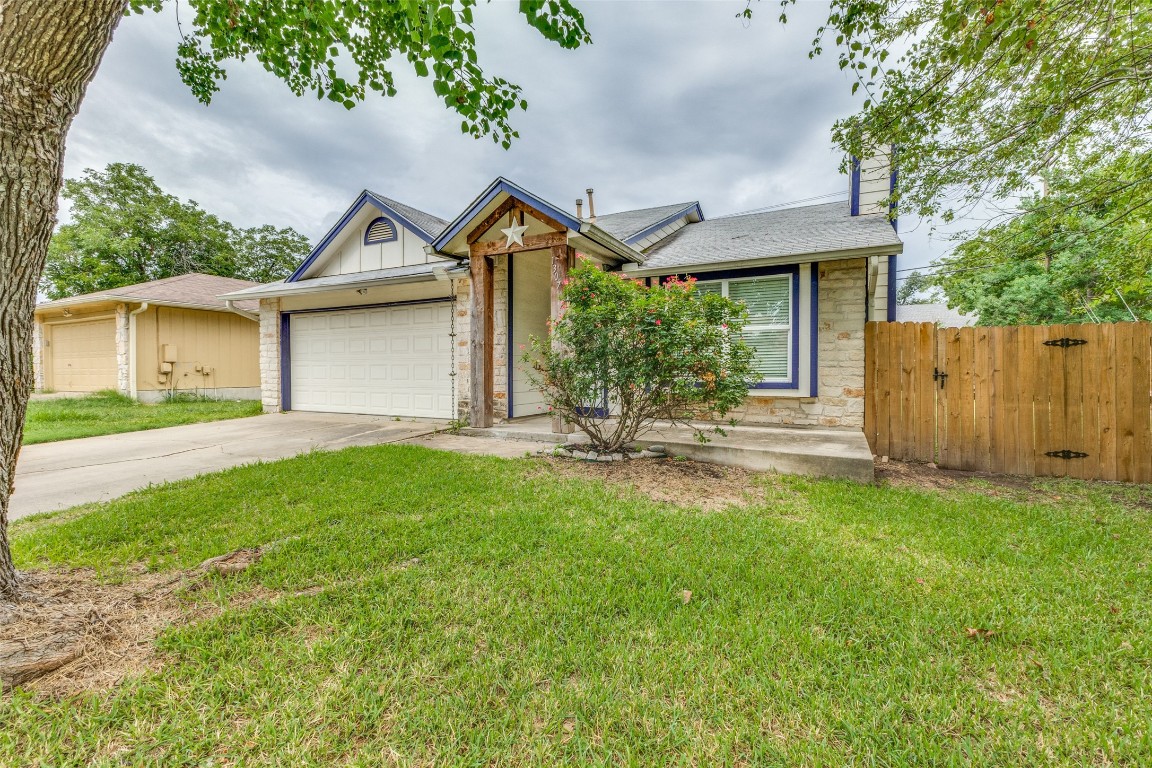 a front view of a house with yard