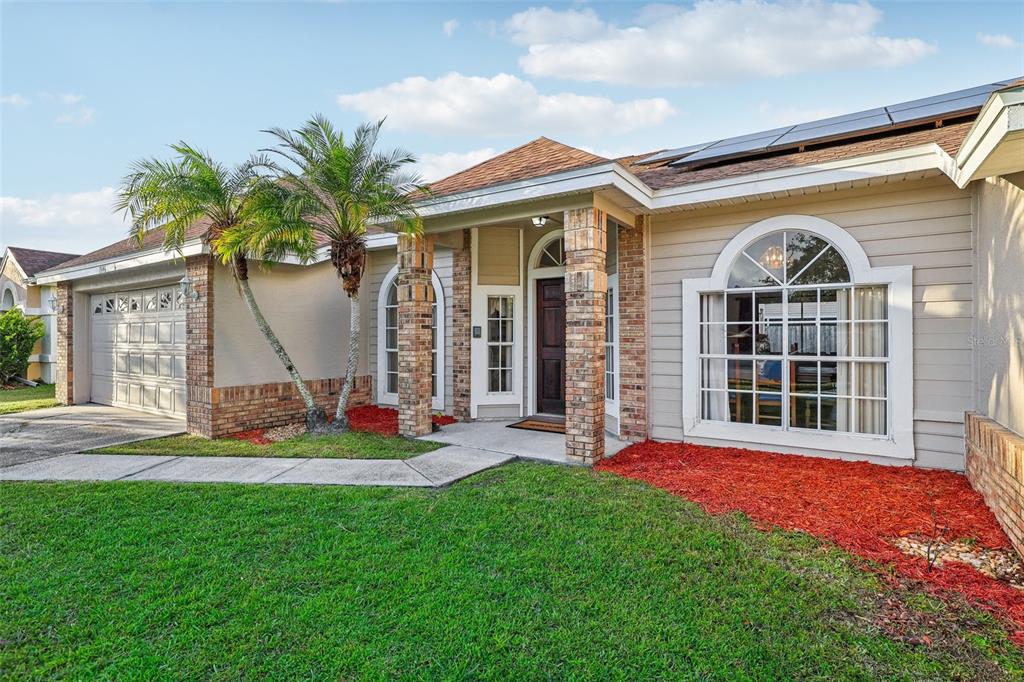 front view of a house with a yard