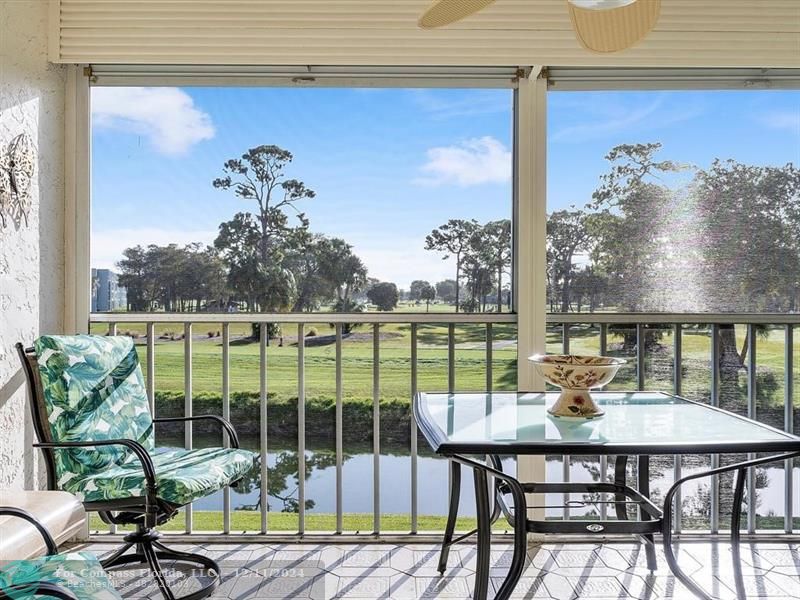 a view of a chairs and table in patio