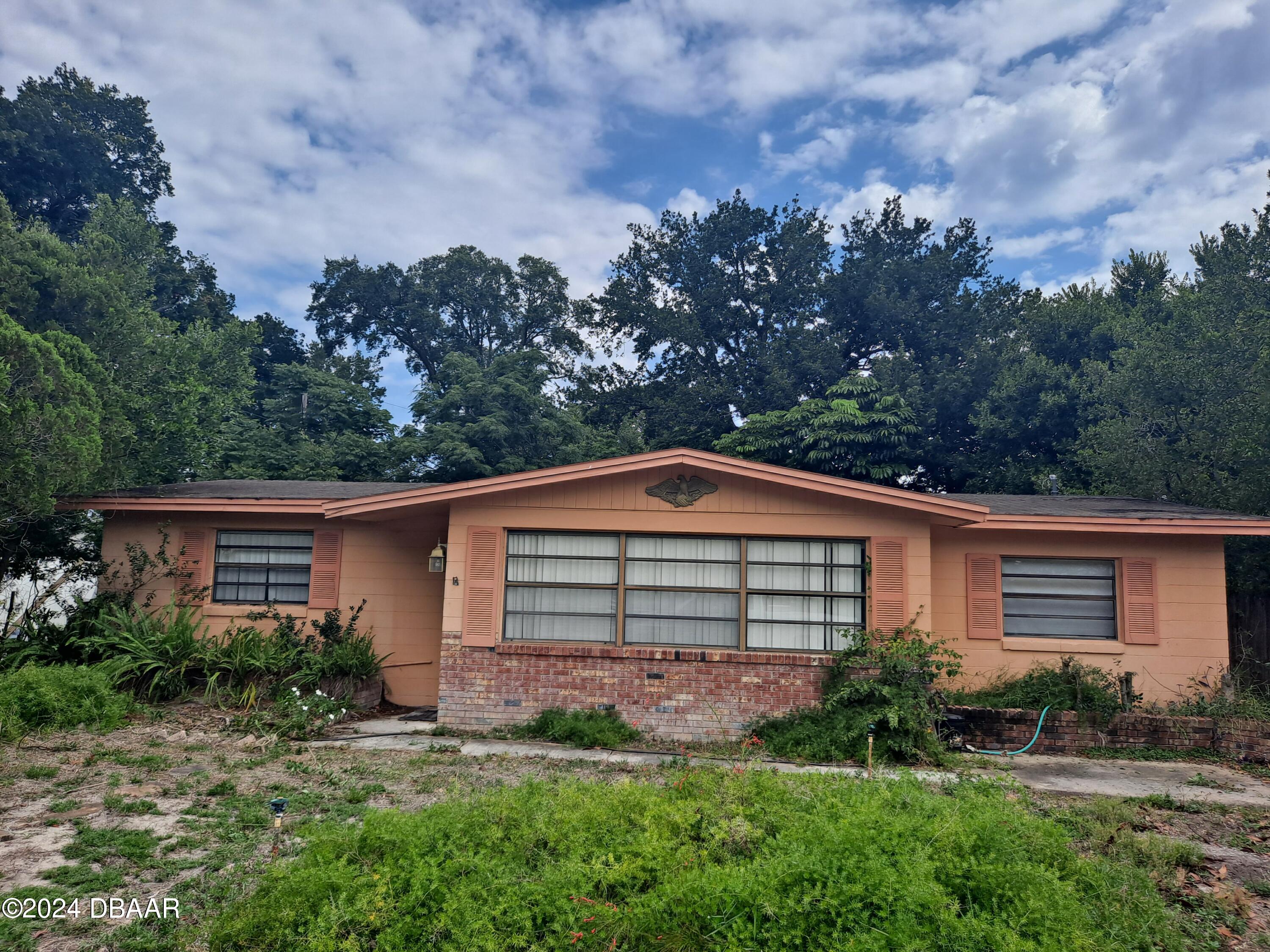 front view of a house with a yard