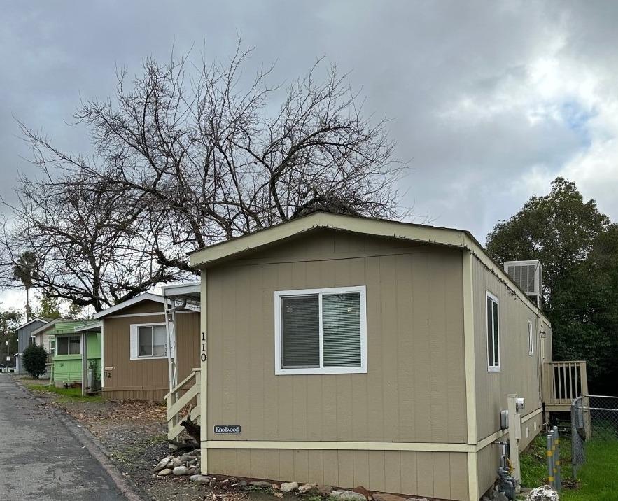 a house with trees in the background