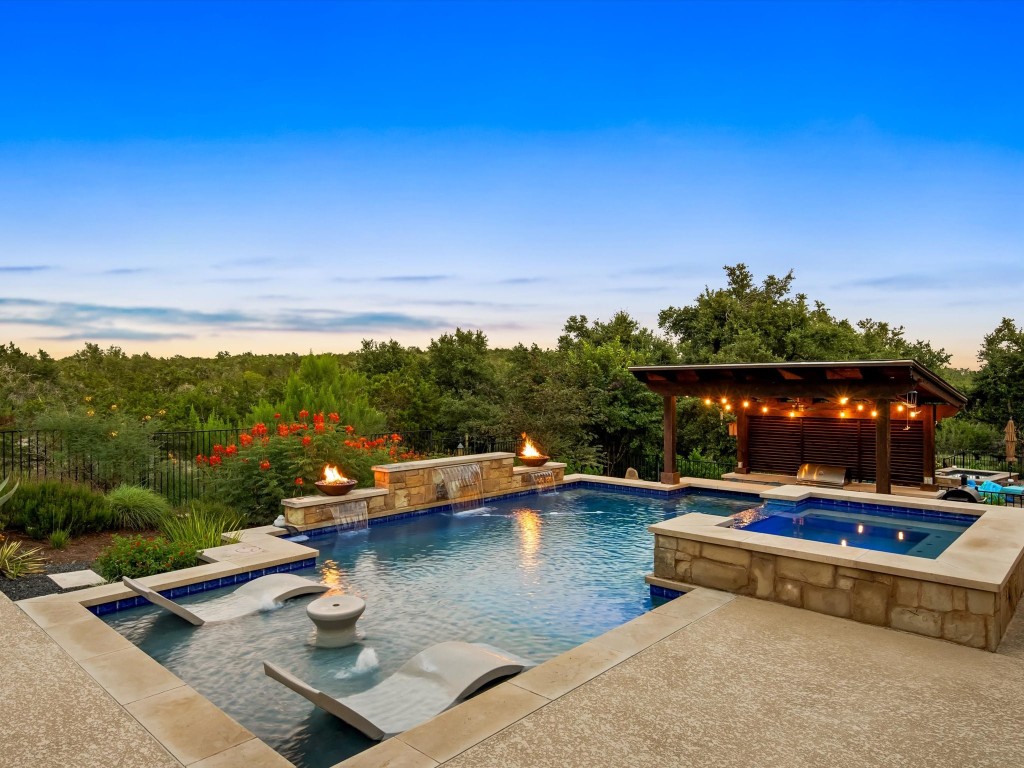 a view of swimming pool with lounge chair